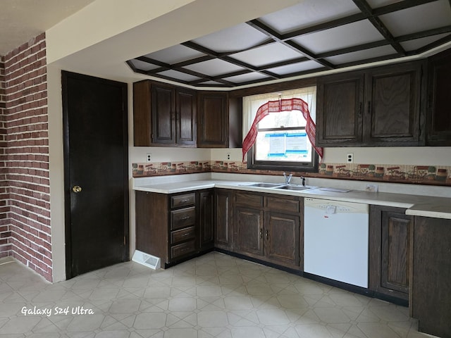 4591 Juneberry Trl, Gaylord, MI 49735 - kitchen with white dishwasher, a sink, light countertops, dark brown cabinets, and coffered ceiling