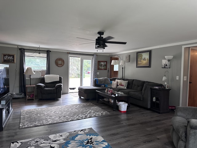 living area with ceiling fan, cooling unit, wood finished floors, and crown molding