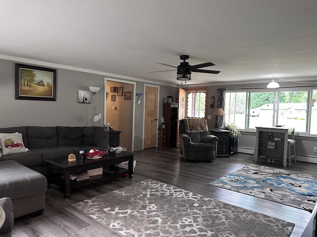 living room with baseboard heating, crown molding, ceiling fan, and wood finished floors