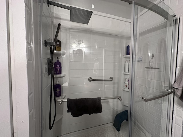 full bath with a shower stall