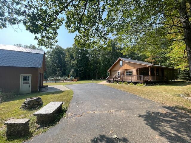 view of road with aphalt driveway