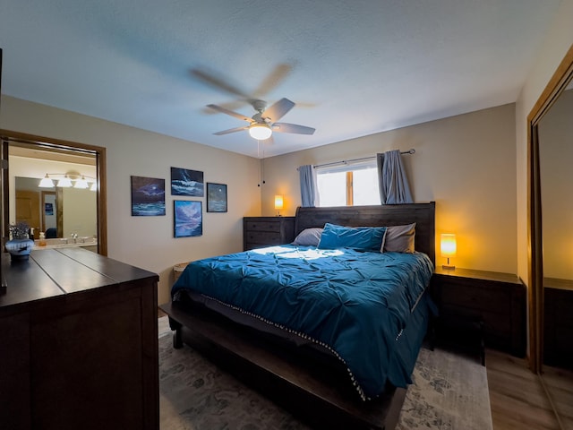 bedroom with a ceiling fan and wood finished floors