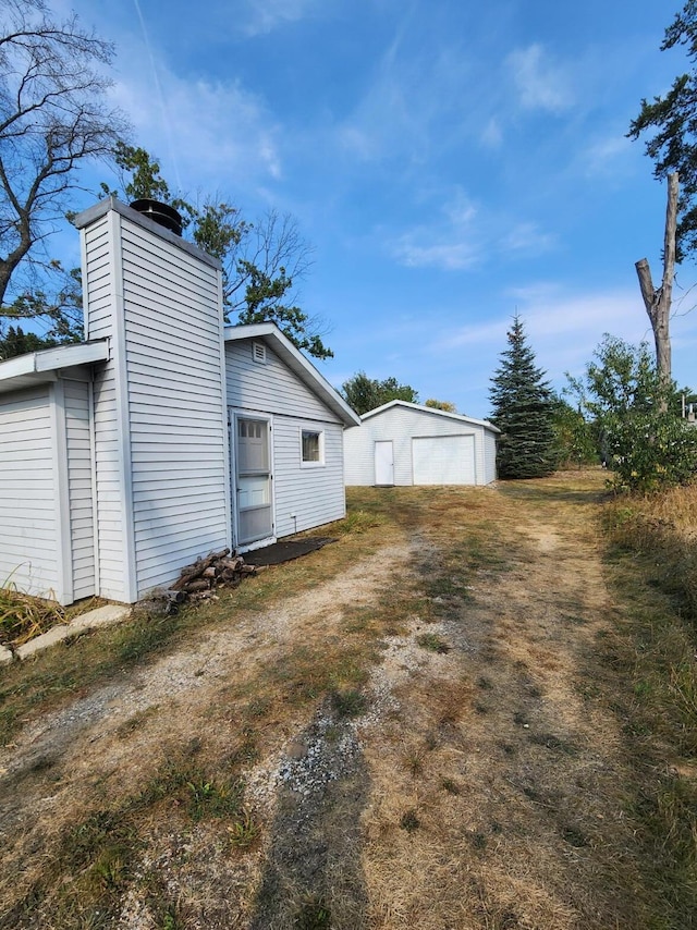 1130 Knollwood, Saint Helen, MI 48656 - view of yard featuring a garage and an outdoor structure