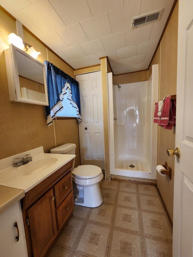 1130 Knollwood, Saint Helen, MI 48656 - bathroom with a walk in shower, vanity, tile patterned floors, and toilet