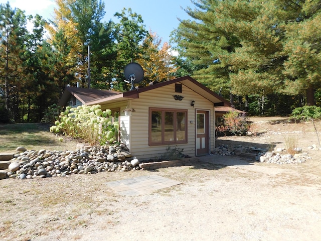 view of front of home with an outdoor structure