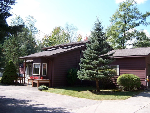 view of home's exterior featuring driveway