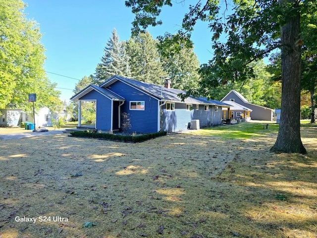 rear view of house with cooling unit