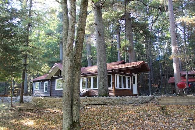 chalet / cabin featuring metal roof