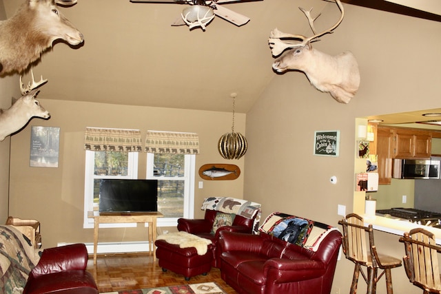 living room with a baseboard radiator, ceiling fan, and vaulted ceiling