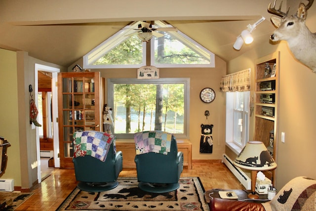 living area with vaulted ceiling, baseboard heating, ceiling fan, and a baseboard radiator