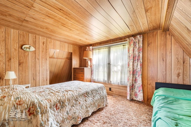 bedroom with wooden walls, wood ceiling, and carpet flooring