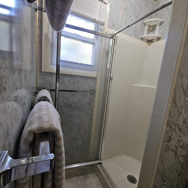 full bath featuring a shower stall