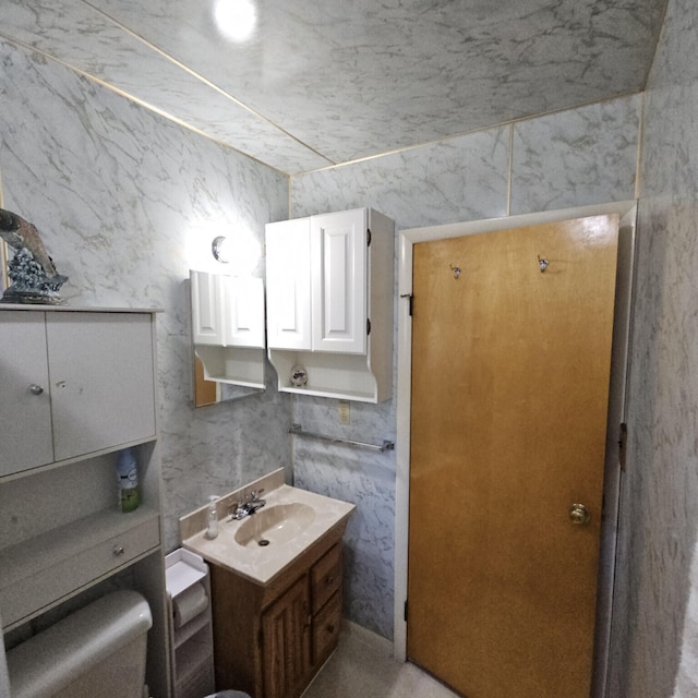 bathroom with toilet and vanity