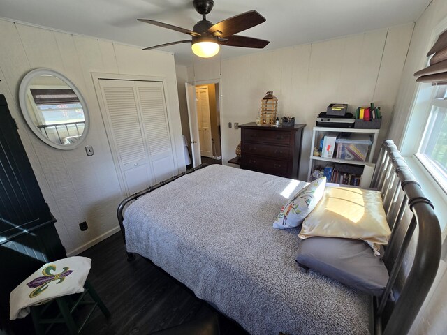 bedroom with a closet, ceiling fan, and wood finished floors