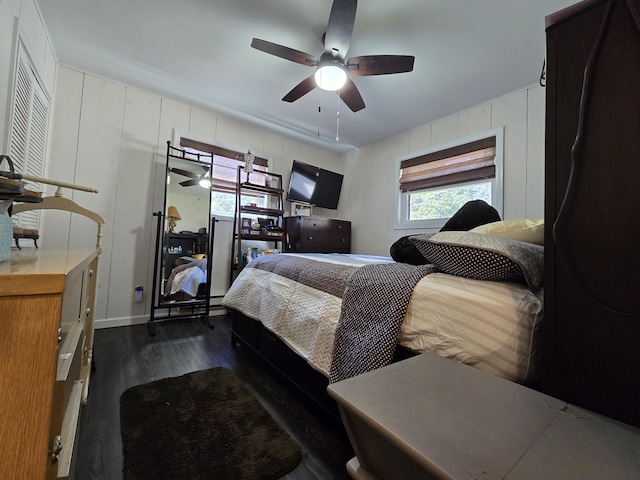 bedroom featuring ceiling fan and dark wood finished floors