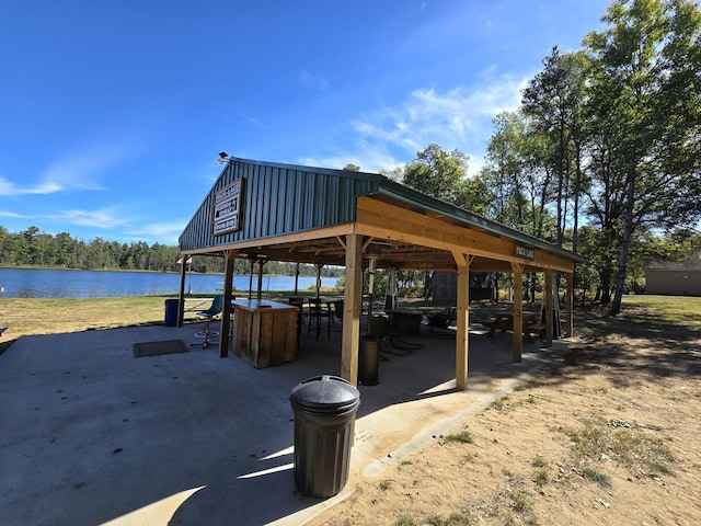 view of property's community with a gazebo and a water view