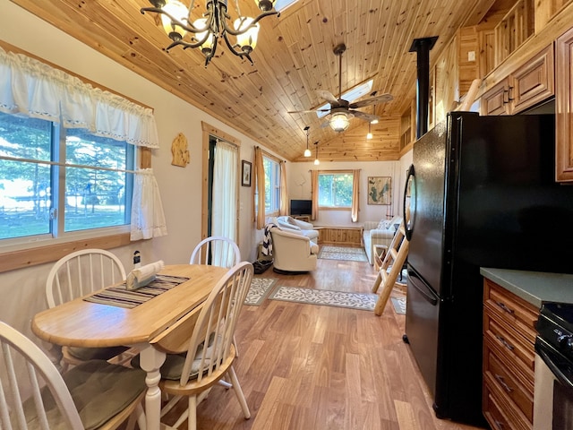 dining space with light wood-style flooring, wooden ceiling, ceiling fan with notable chandelier, and vaulted ceiling