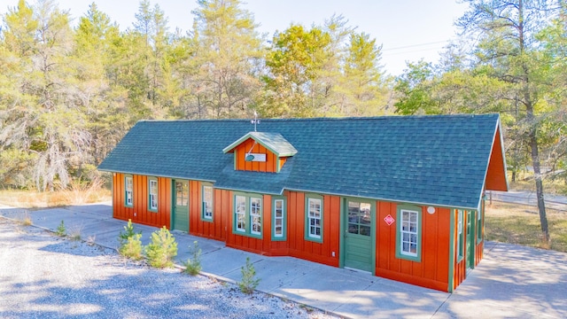 view of front of property with board and batten siding and a shingled roof