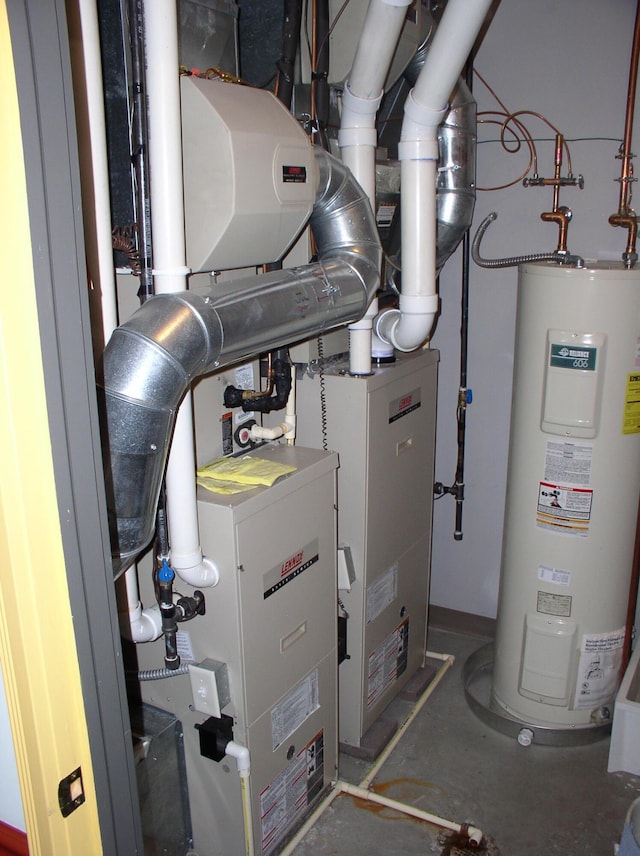 utility room featuring electric water heater