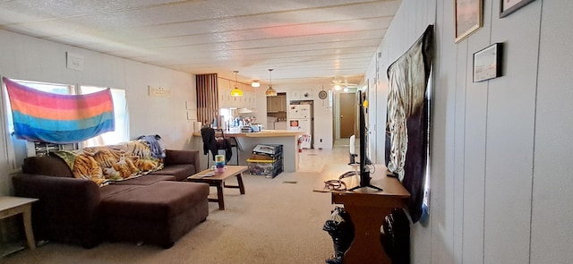 living area with light colored carpet