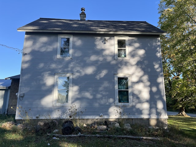 view of home's exterior with a chimney