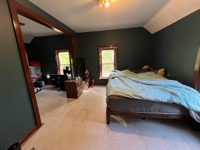 bedroom with lofted ceiling