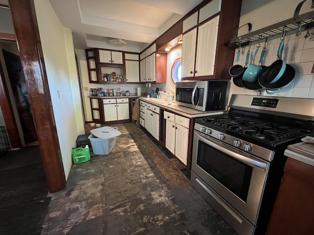 kitchen featuring backsplash, appliances with stainless steel finishes, open shelves, and a sink