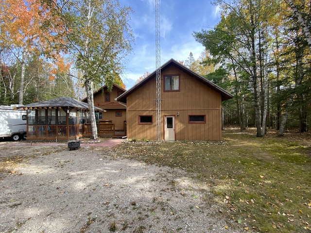 back of property with a wooden deck