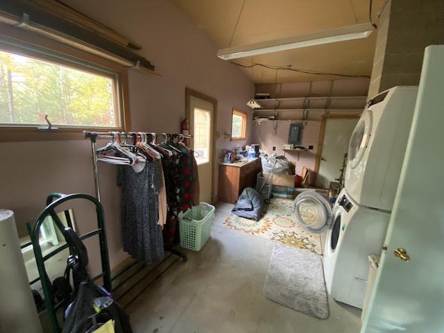 garage with stacked washer and dryer