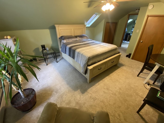 bedroom with light carpet, lofted ceiling, and ceiling fan