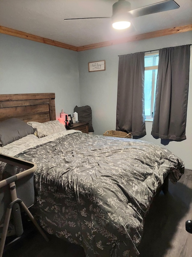 bedroom featuring a ceiling fan and crown molding