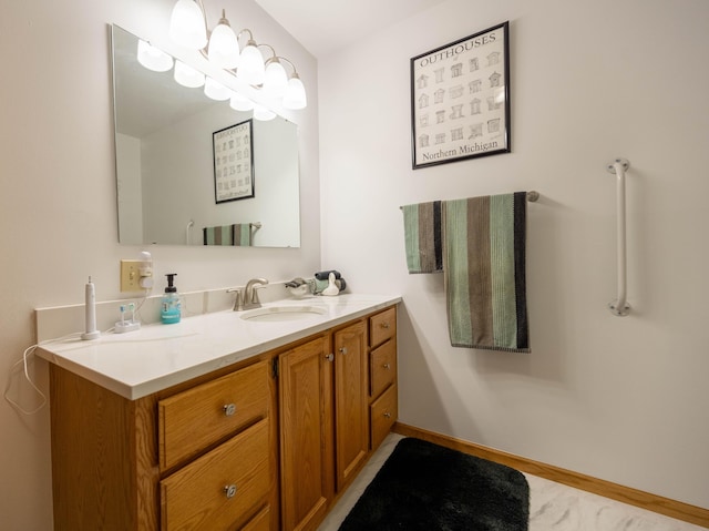 bathroom with baseboards and vanity