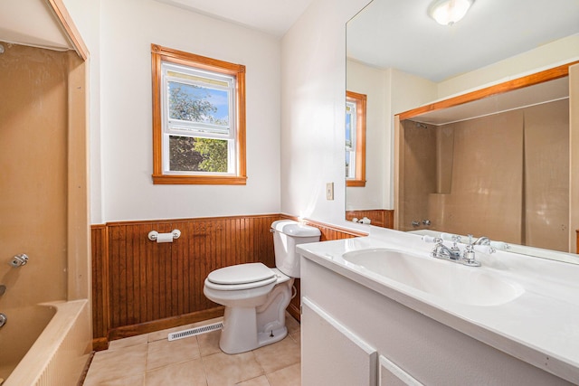 full bath with visible vents, toilet, wood walls, wainscoting, and tile patterned flooring