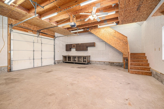 garage featuring a garage door opener and a ceiling fan