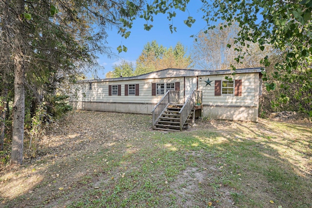 manufactured / mobile home featuring stairway