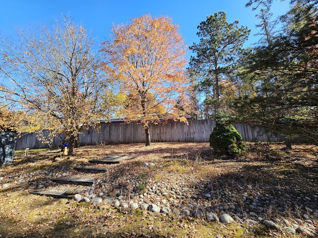 view of yard featuring fence