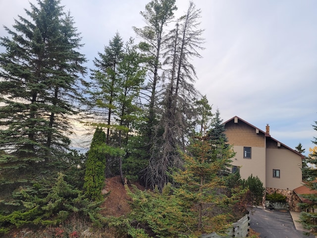 view of side of home with a chimney