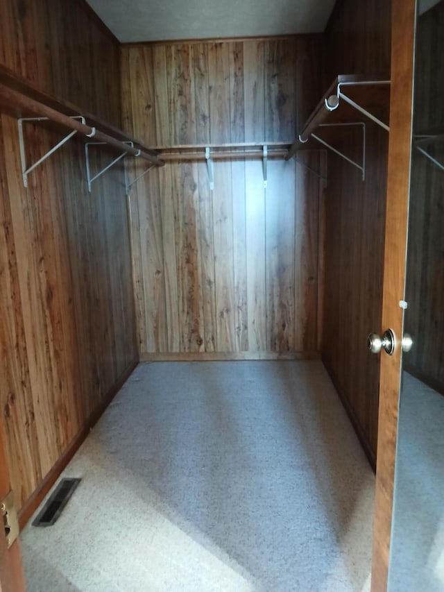 spacious closet featuring visible vents