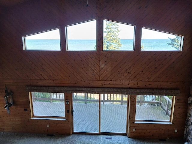 details featuring visible vents, a water view, and carpet