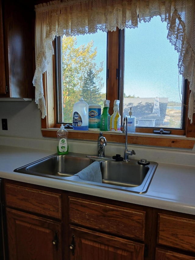 kitchen with a sink and light countertops