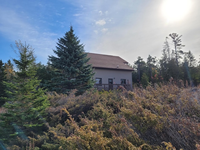 back of property featuring a wooden deck