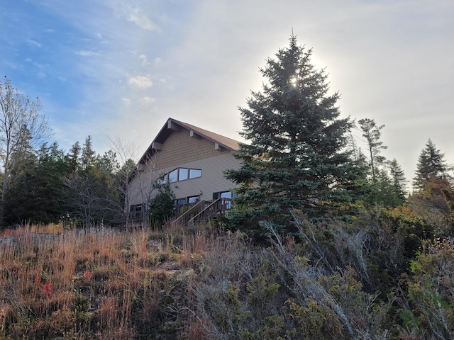 view of property exterior with stairway