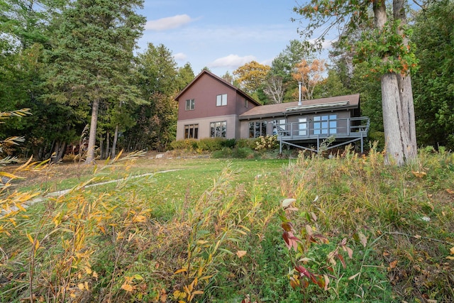 rear view of house with a wooden deck