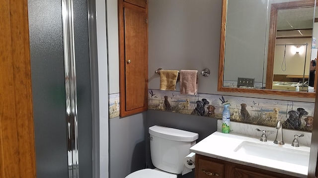 bathroom with toilet and vanity