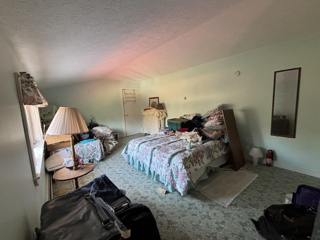 carpeted bedroom featuring lofted ceiling and a textured ceiling