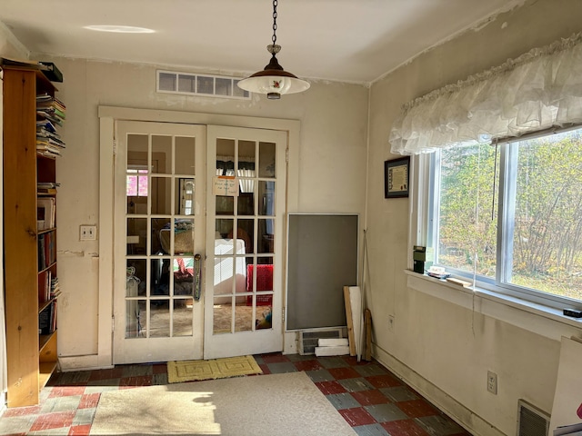 entryway featuring tile patterned floors, french doors, and visible vents