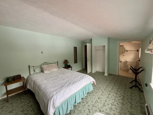 6658 M-33, Onaway, MI 49765 - bedroom featuring carpet floors, vaulted ceiling, a closet, a textured ceiling, and a baseboard heating unit