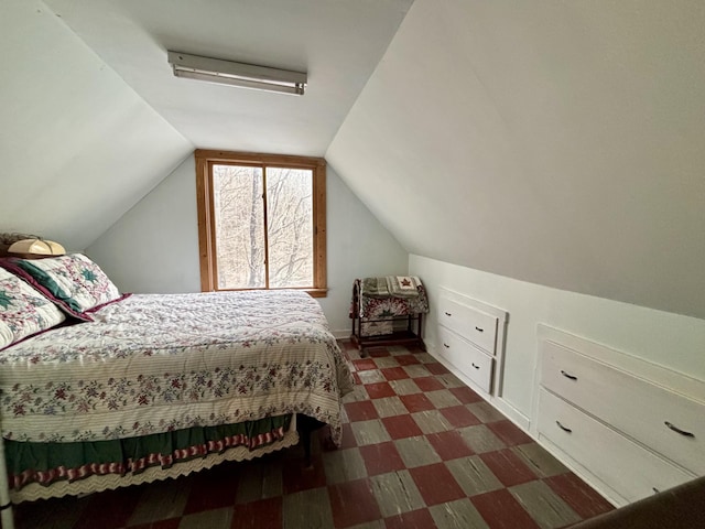 6658 M-33, Onaway, MI 49765 - bedroom with tile patterned floors and lofted ceiling