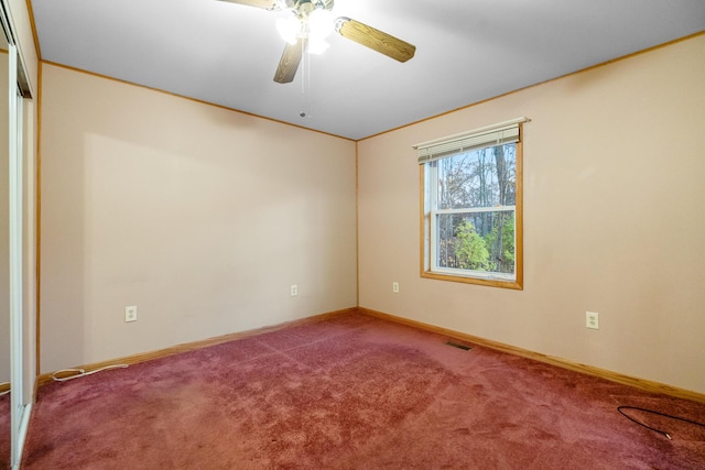 4963 Eastway Dr, Indian River, MI 49749 - carpeted spare room with visible vents, baseboards, ornamental molding, and a ceiling fan
