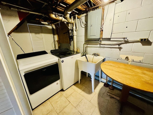 clothes washing area with laundry area, electric panel, light tile patterned flooring, a sink, and washing machine and dryer